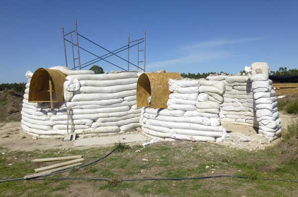 Work continues on the nearby earthbag house, Uruguay